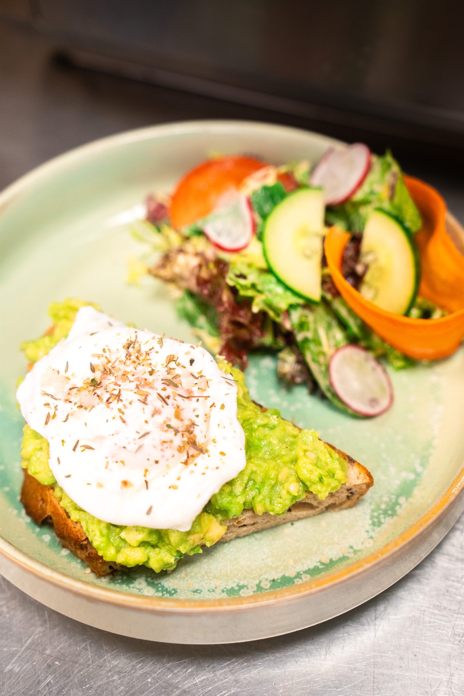 Smashed avocado on sourdough with a poached egg