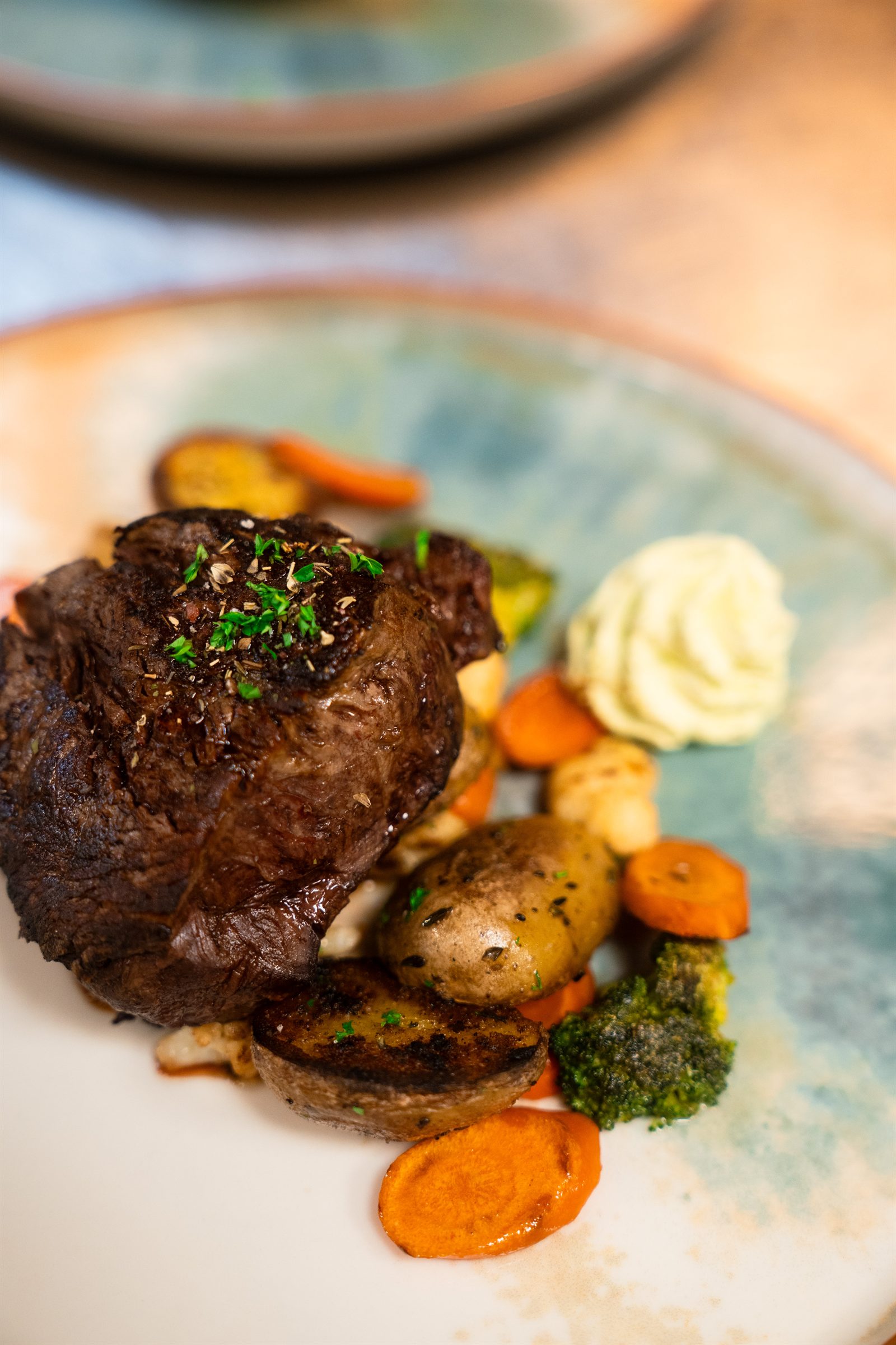 Grilled beef plated with vegetables